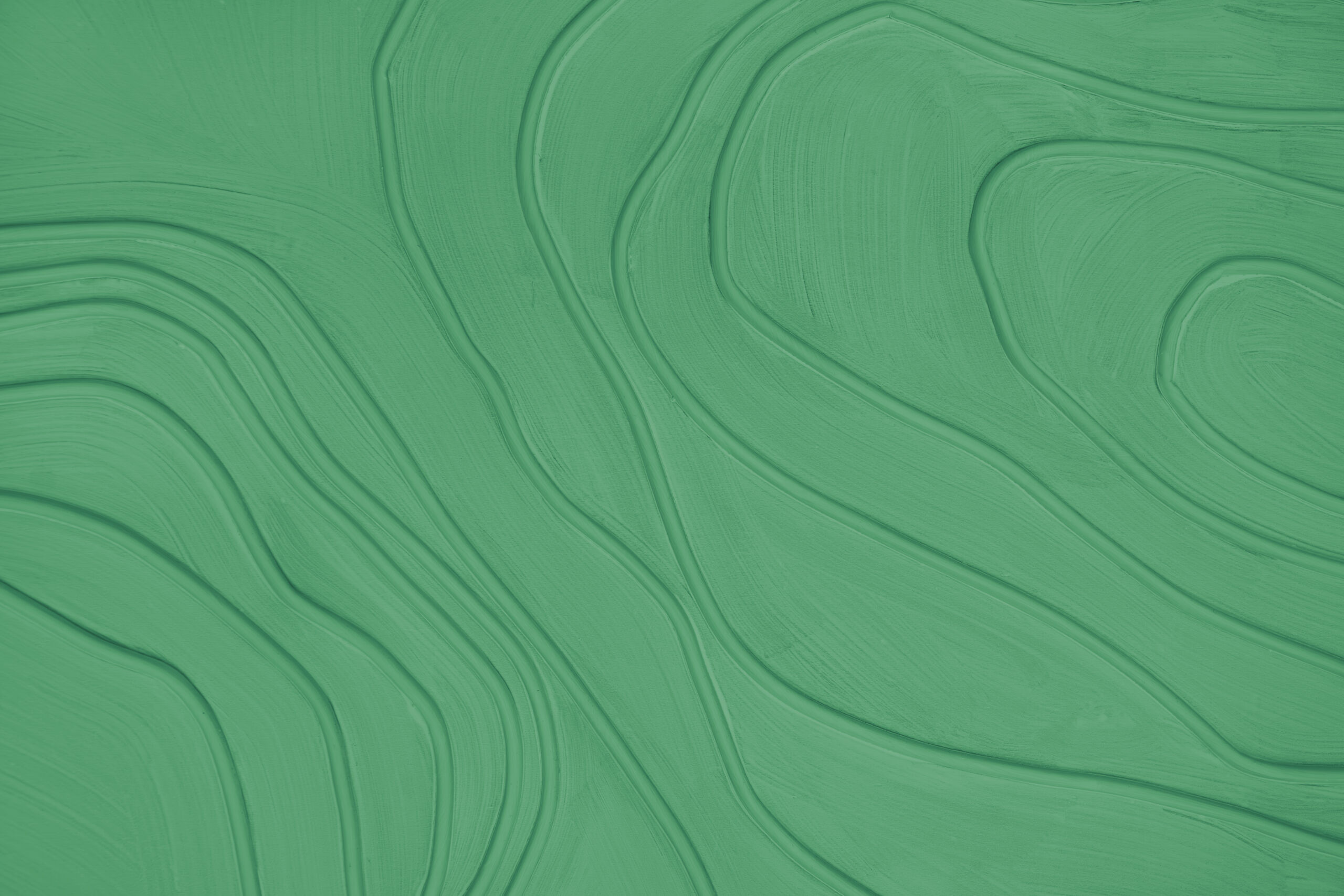 Plaster wall with volumetric relief surface with random convex lines and waves pattern, green gypsum texture panel. Interior decoration, design element. Wallpaper,background, backdrop, copy space