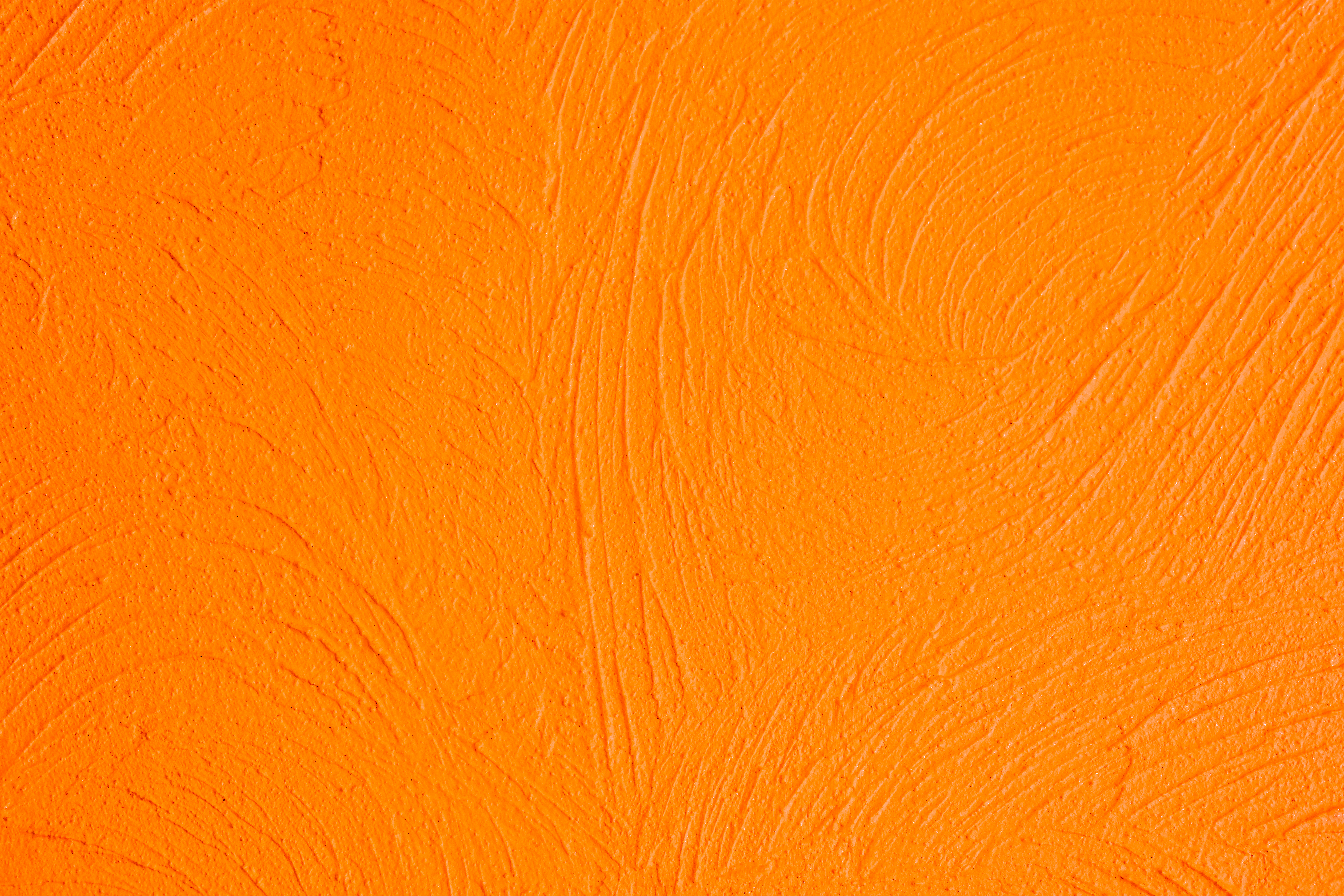 Textured orange surface with visible brush strokes.
